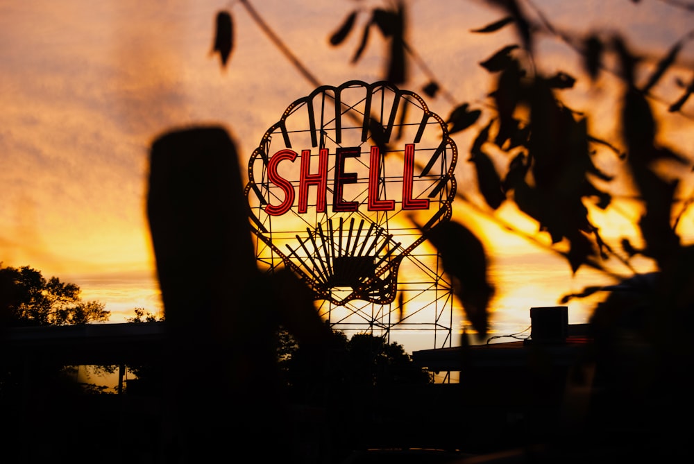 silhouette of basketball hoop during sunset