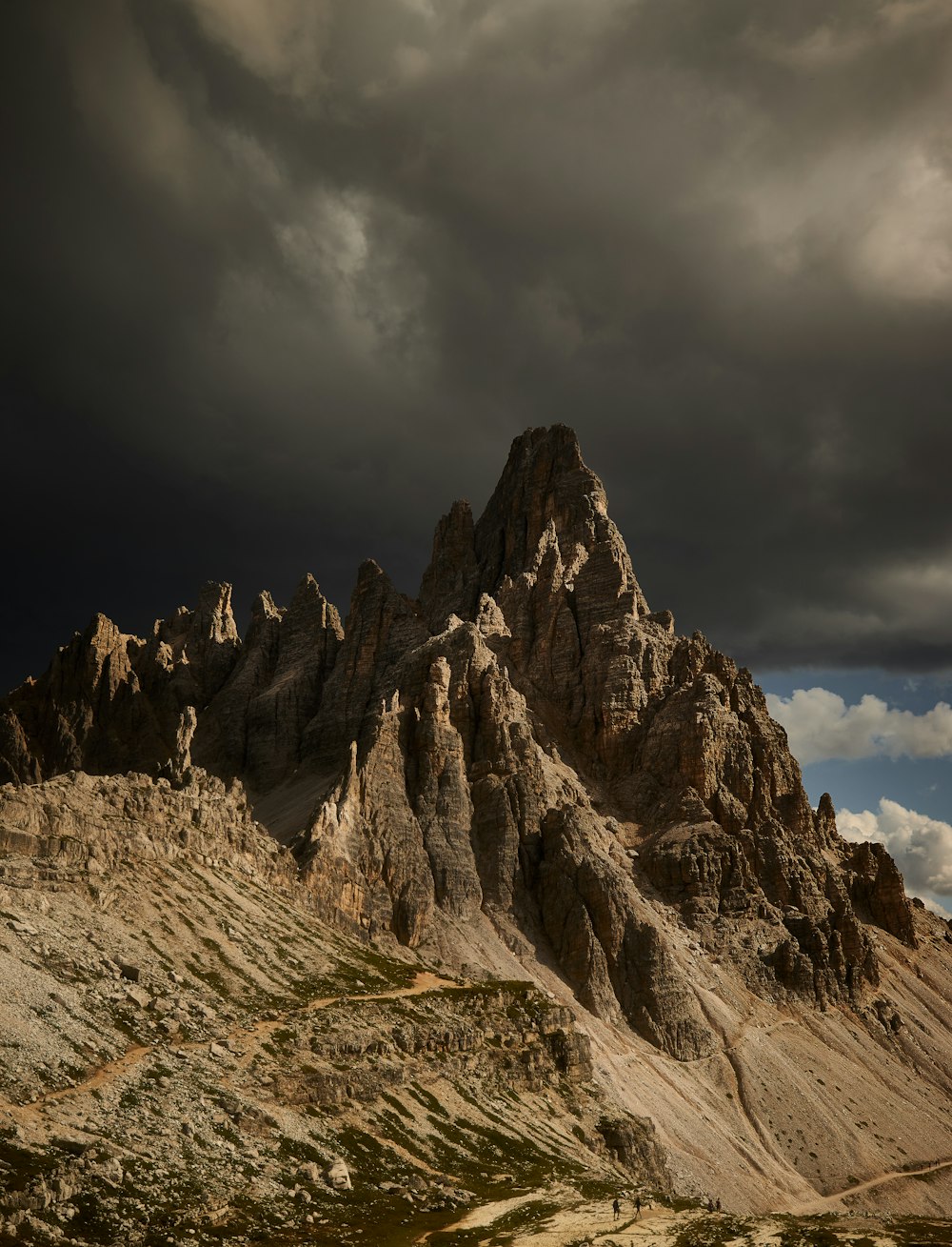 brown rocky mountain under cloudy sky during daytime