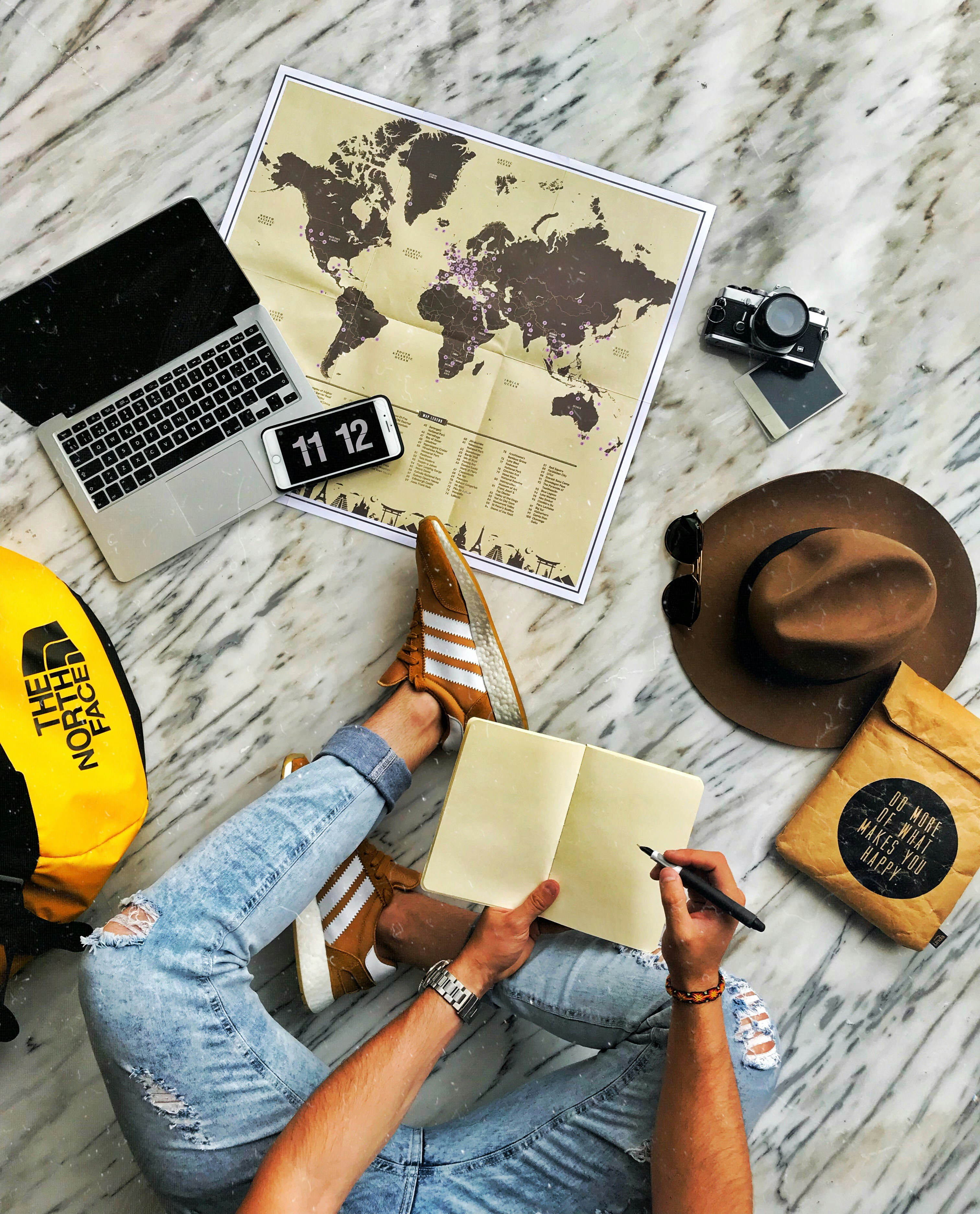 person in blue denim jeans and yellow shirt sitting on yellow chair