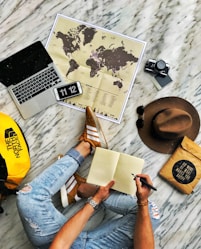 person in blue denim jeans and yellow shirt sitting on yellow chair