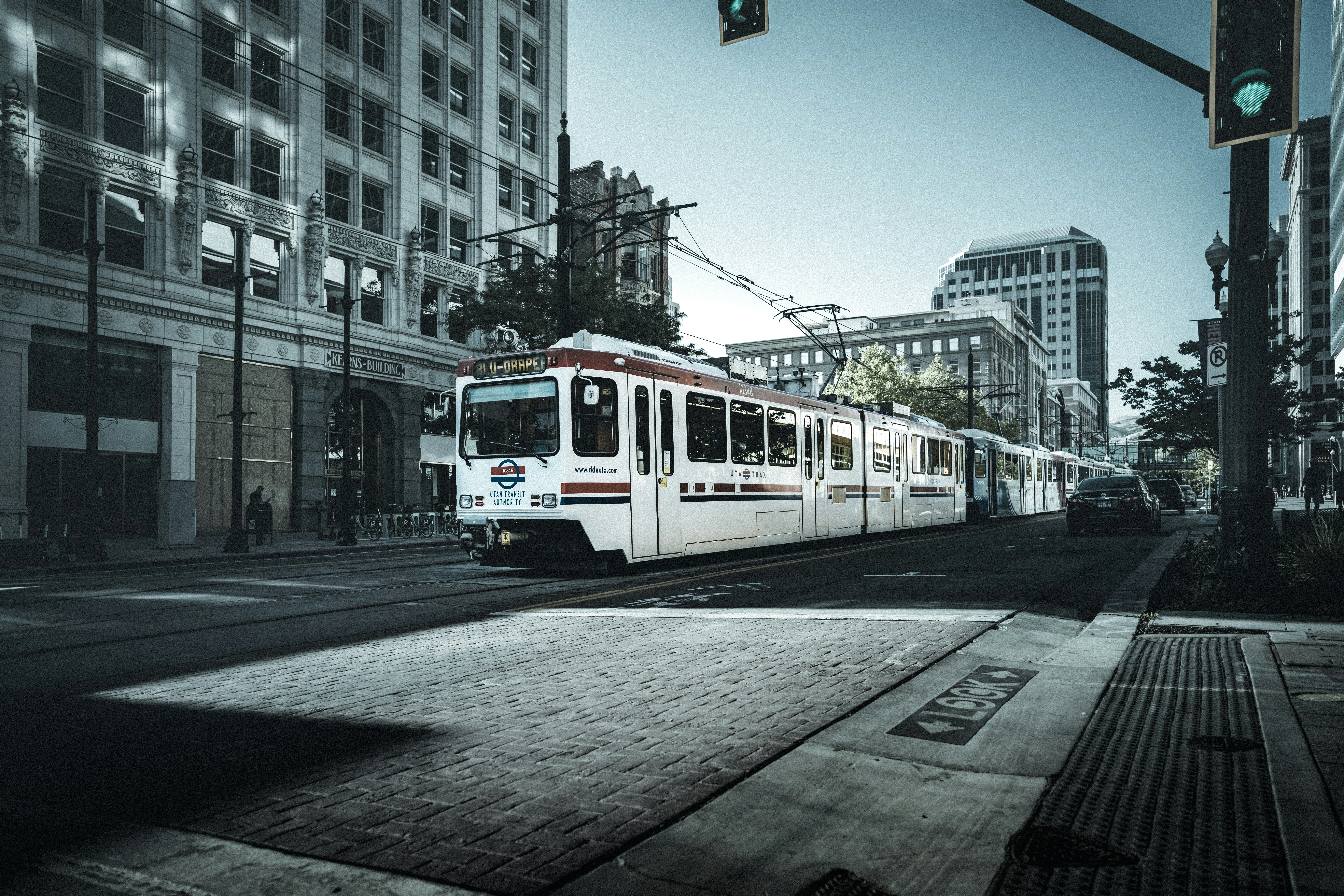 white and red tram on road during daytime, 