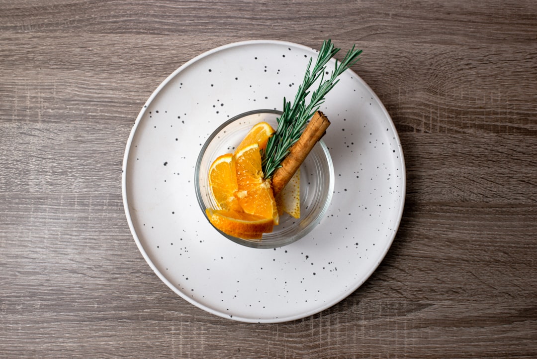 sliced lemon in white ceramic bowl