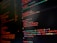 A computer screen displaying colorful lines of code primarily written in JavaScript. The background is dark with code highlighted in various colors like orange, green, and red to differentiate syntax elements.