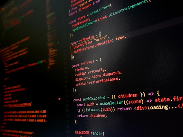 A computer screen displaying colorful lines of code primarily written in JavaScript. The background is dark with code highlighted in various colors like orange, green, and red to differentiate syntax elements.
