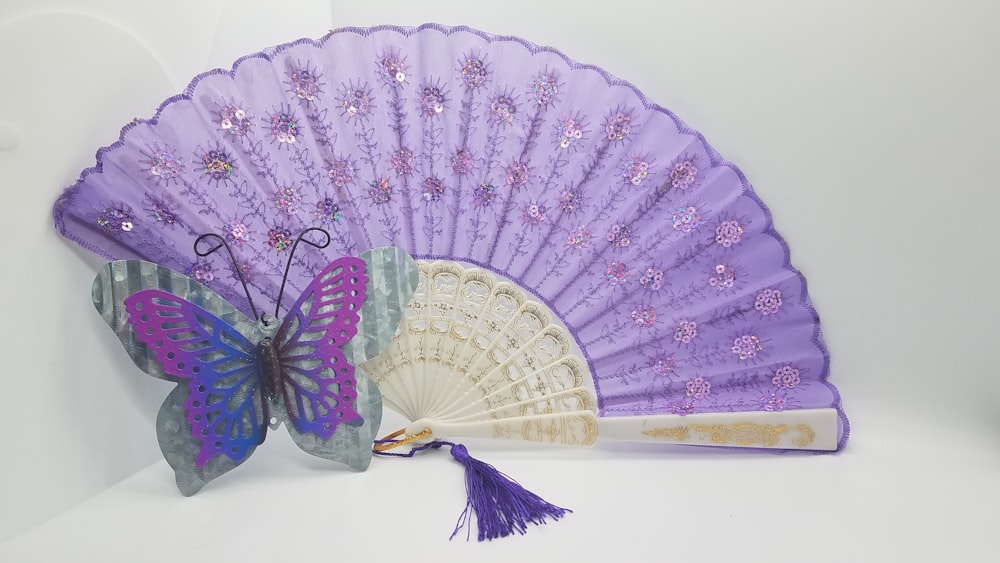 purple and blue floral hand fan