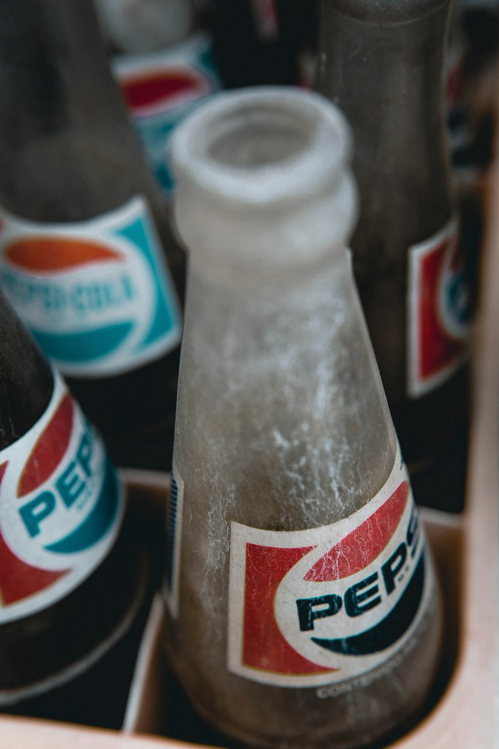 coca cola bottle on brown wooden table