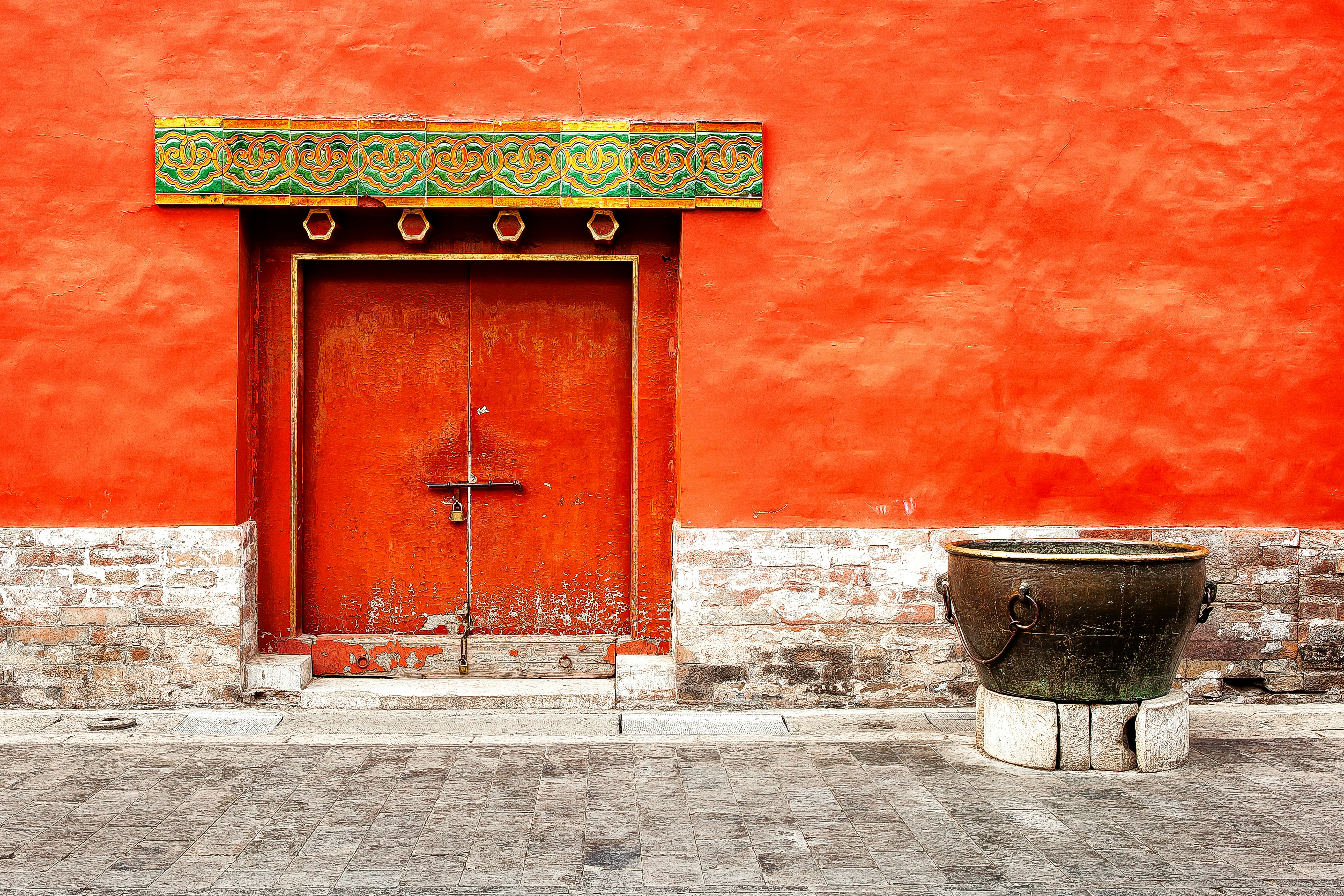 brown wooden door with green door mat