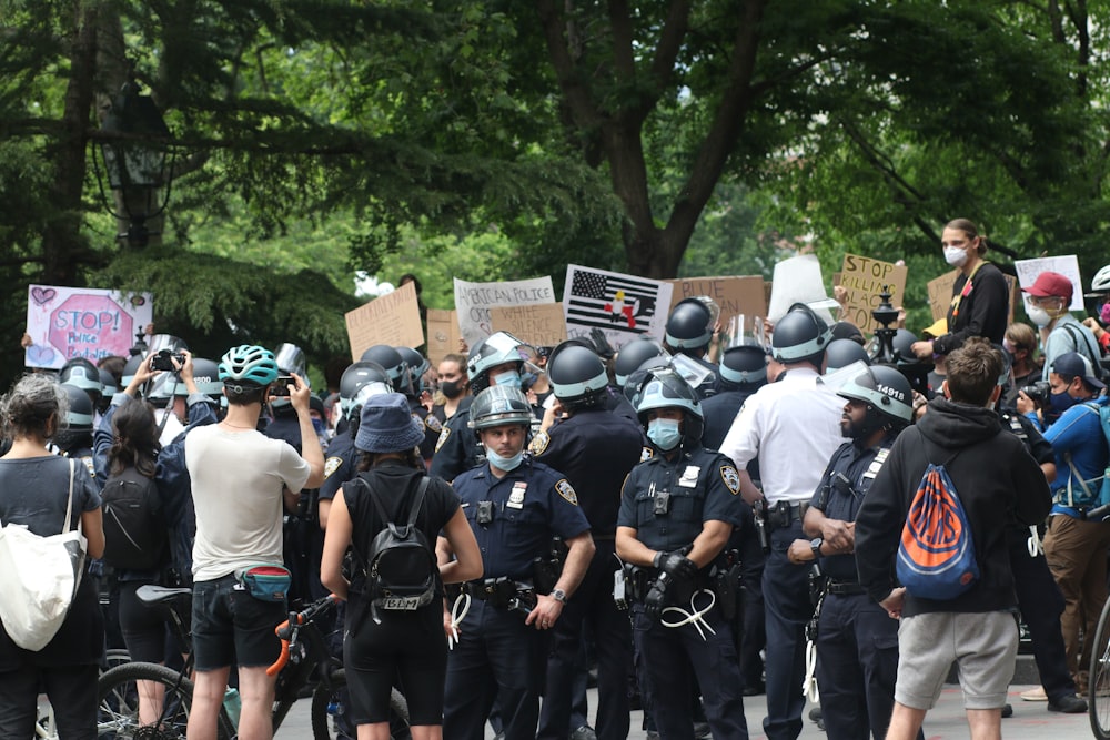 group of people wearing black and white helmet and helmet