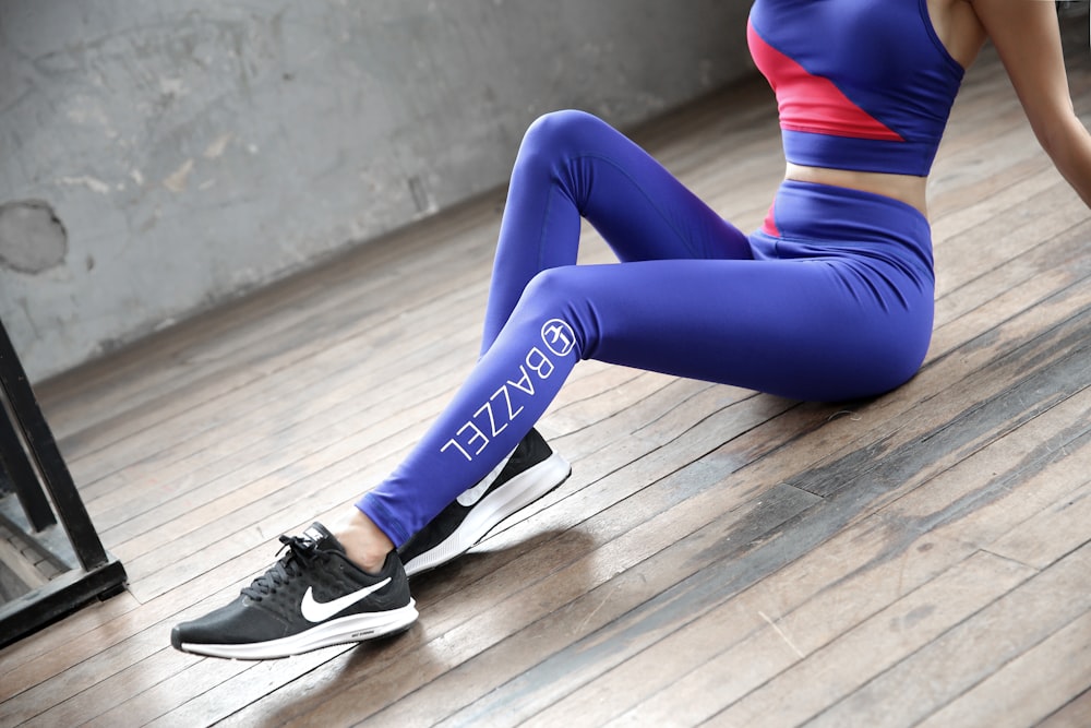 woman in blue leggings and black and white nike sneakers photo – Free  Wellness Image on Unsplash