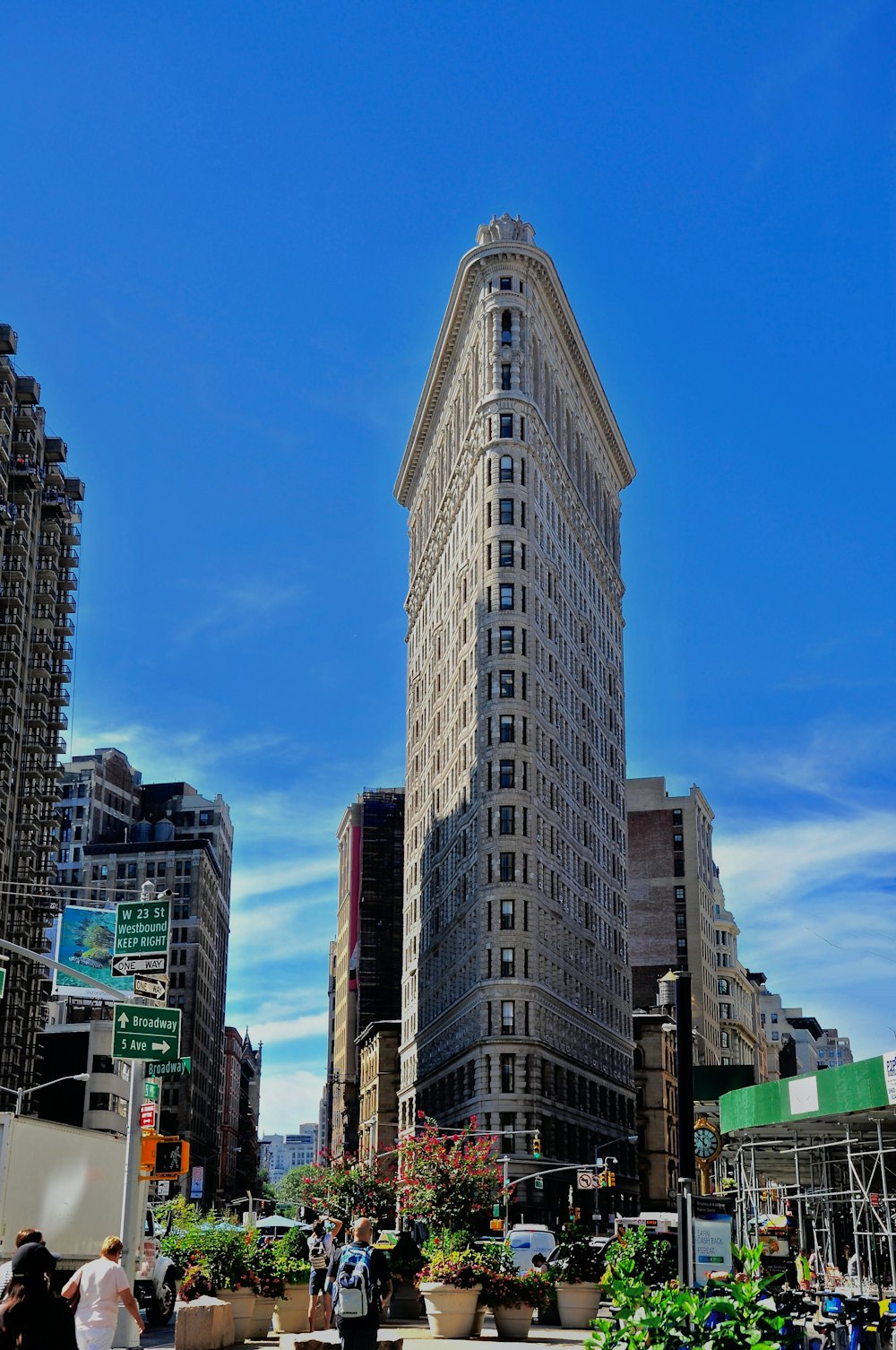 cars on road near high rise buildings during daytime