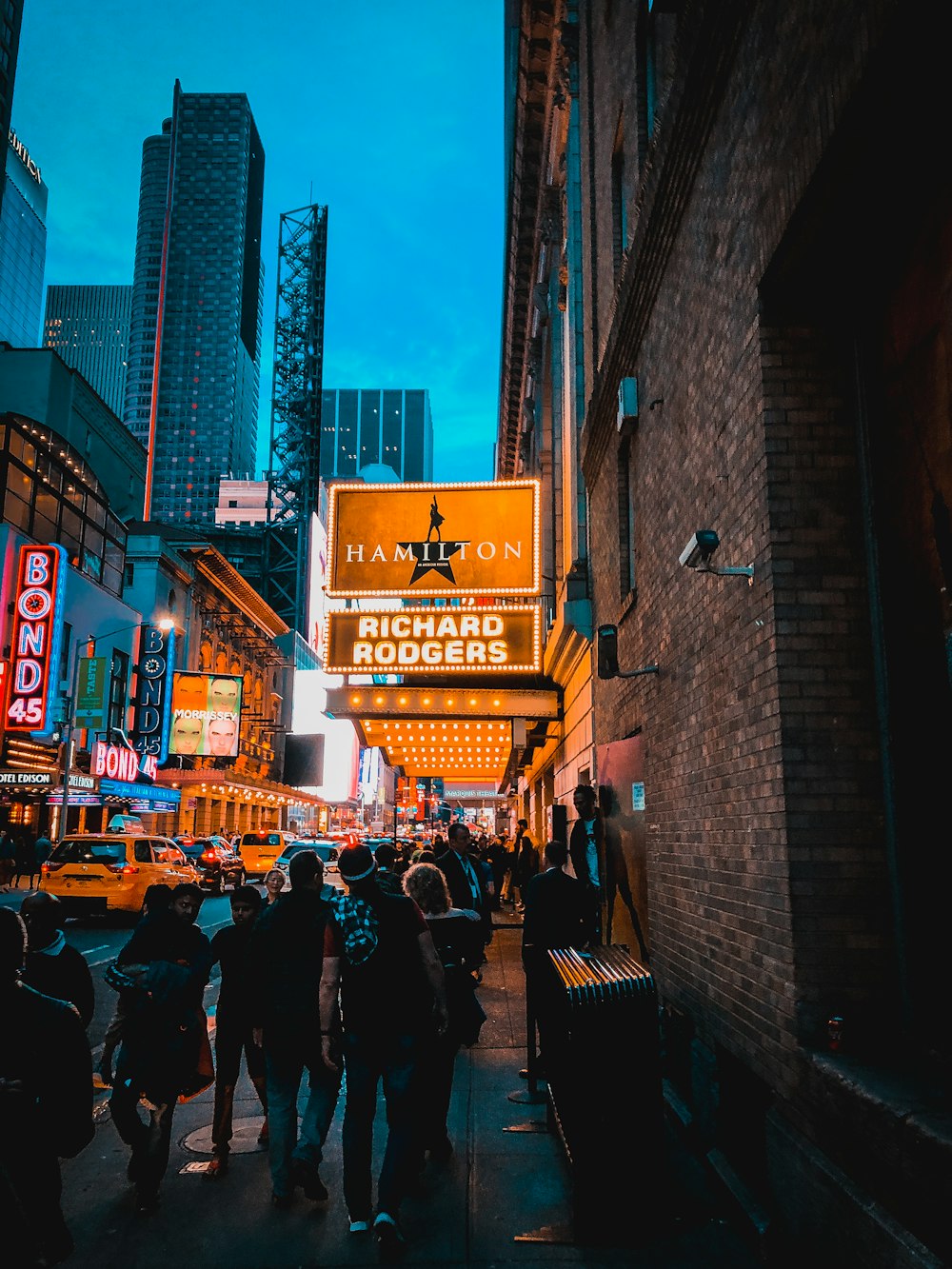 people walking on street during night time