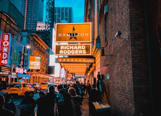 people walking on street during night time