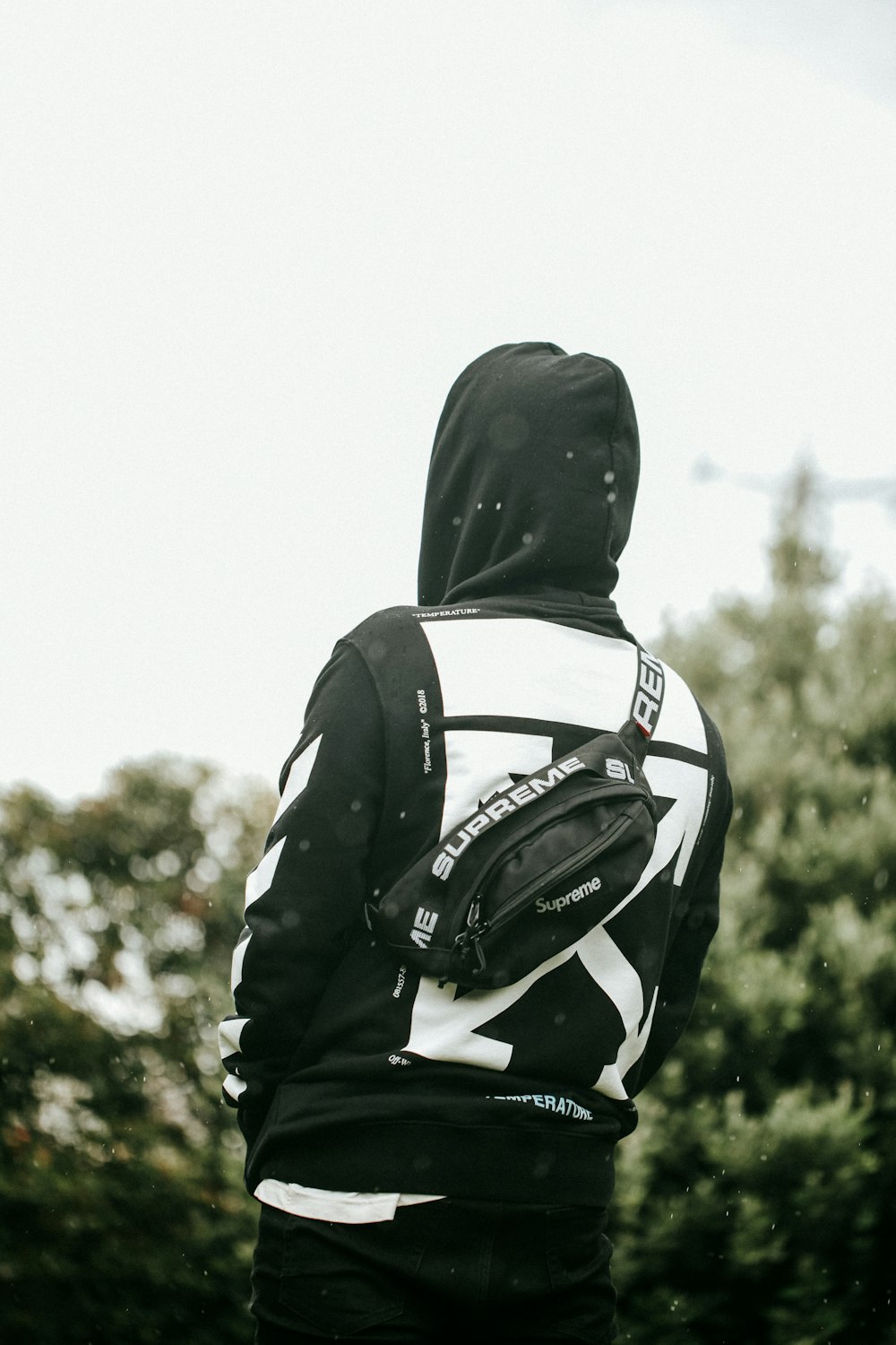 person in black and white hoodie