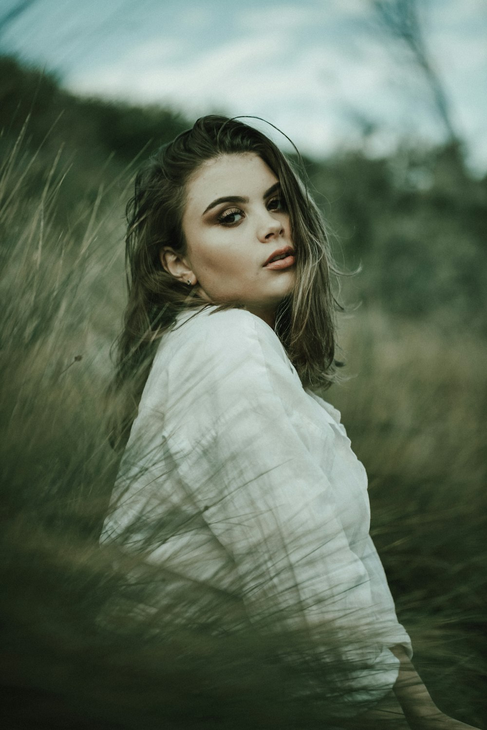 woman in white long sleeve shirt