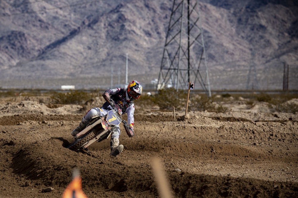 man in white and red helmet riding white and red motorcycle during daytime