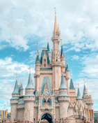 Cinderella Castle with blue turrets and stone walls in Magic Kingdom, Orlando