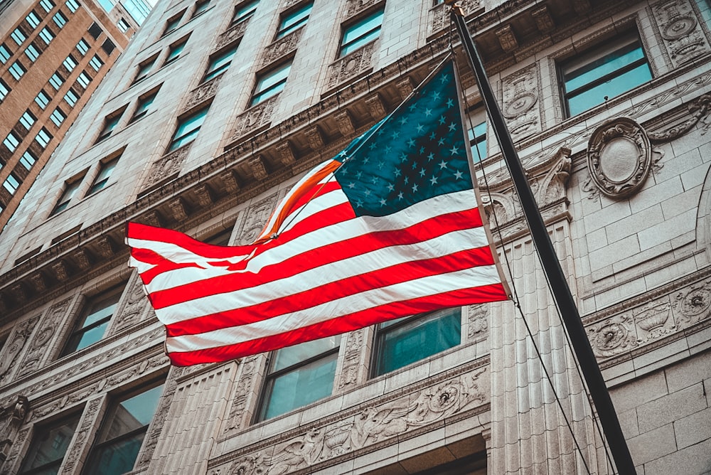 us a flag on gray concrete building