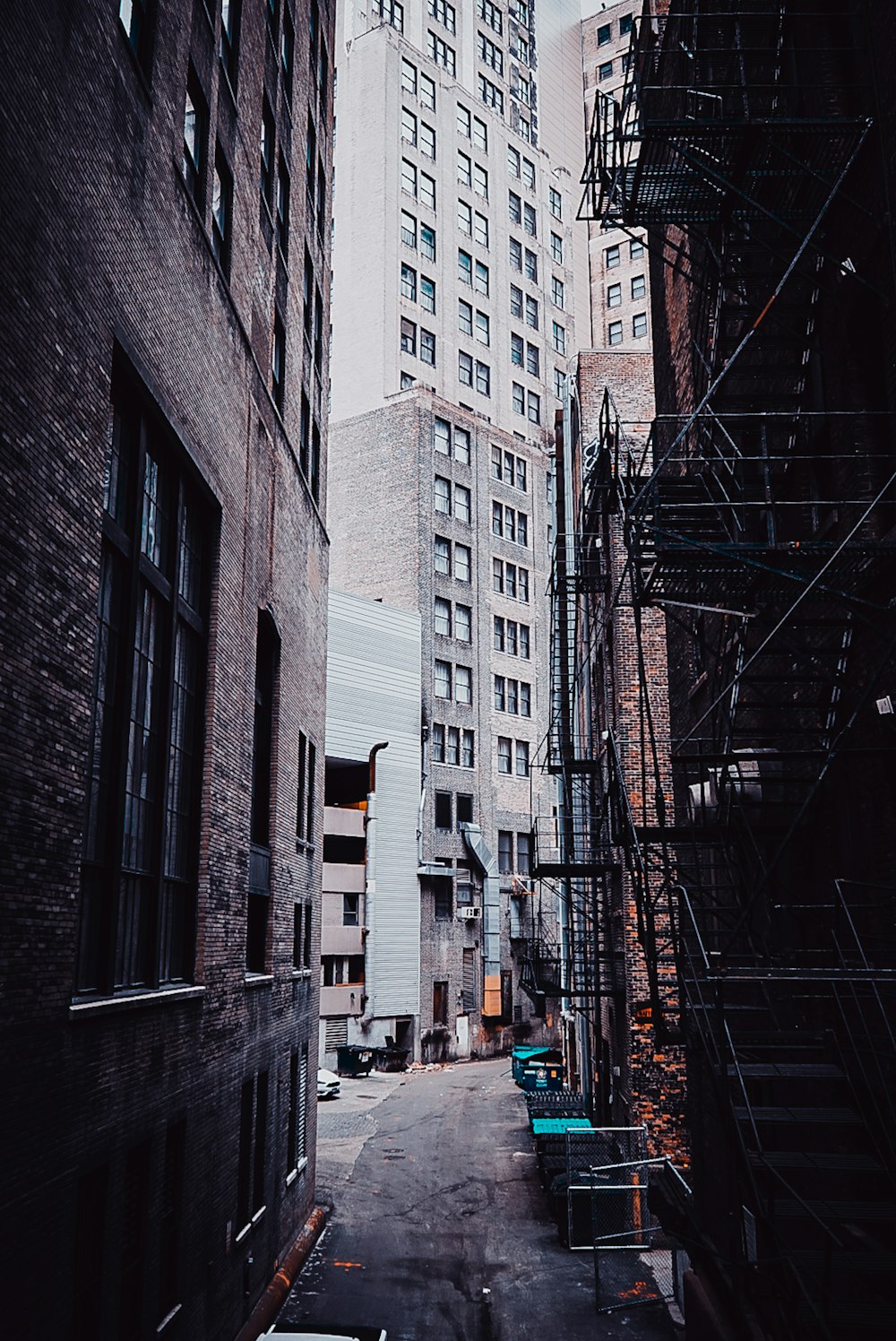 people walking on sidewalk near buildings during daytime