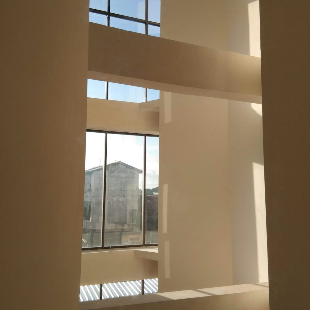 white concrete pillar near window