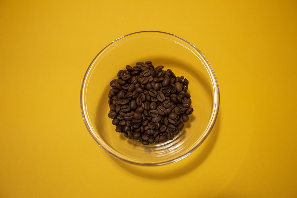 brown coffee beans in clear glass bowl