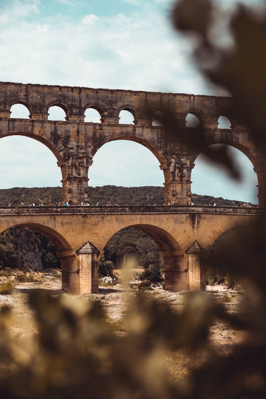 brown concrete bridge during daytime in Pont du Gard France