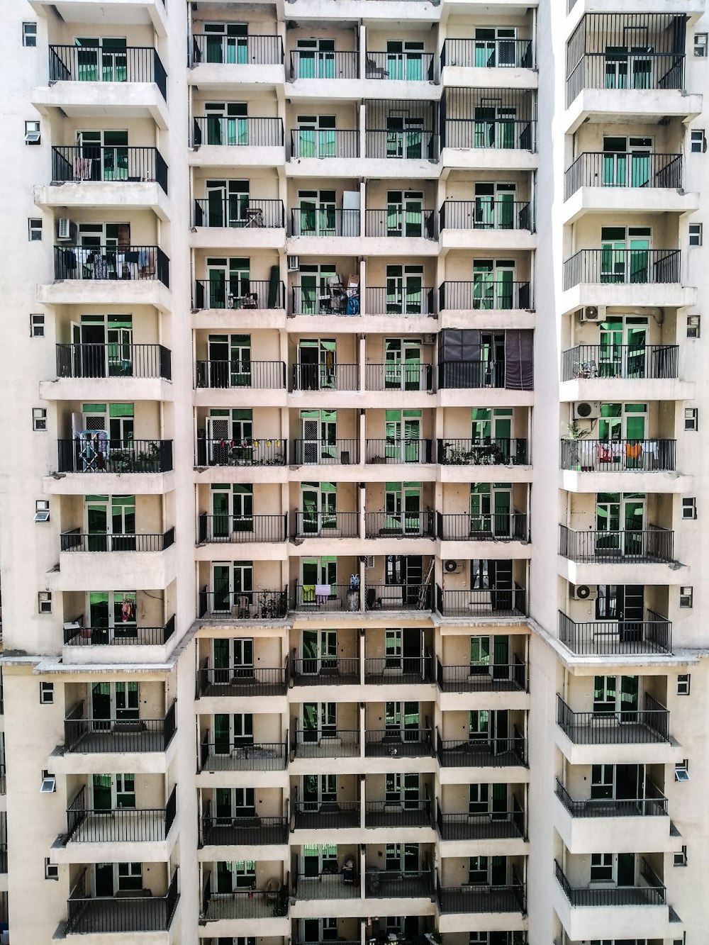 white concrete building with glass windows