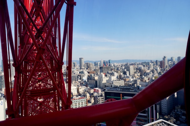 A panoramic view of a completed multi-story building under a clear blue sky.
