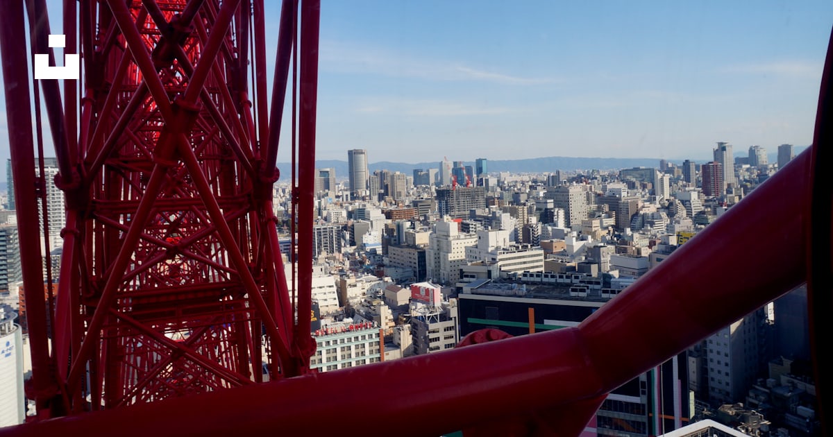 Red metal railings near city buildings during daytime photo – Free ...