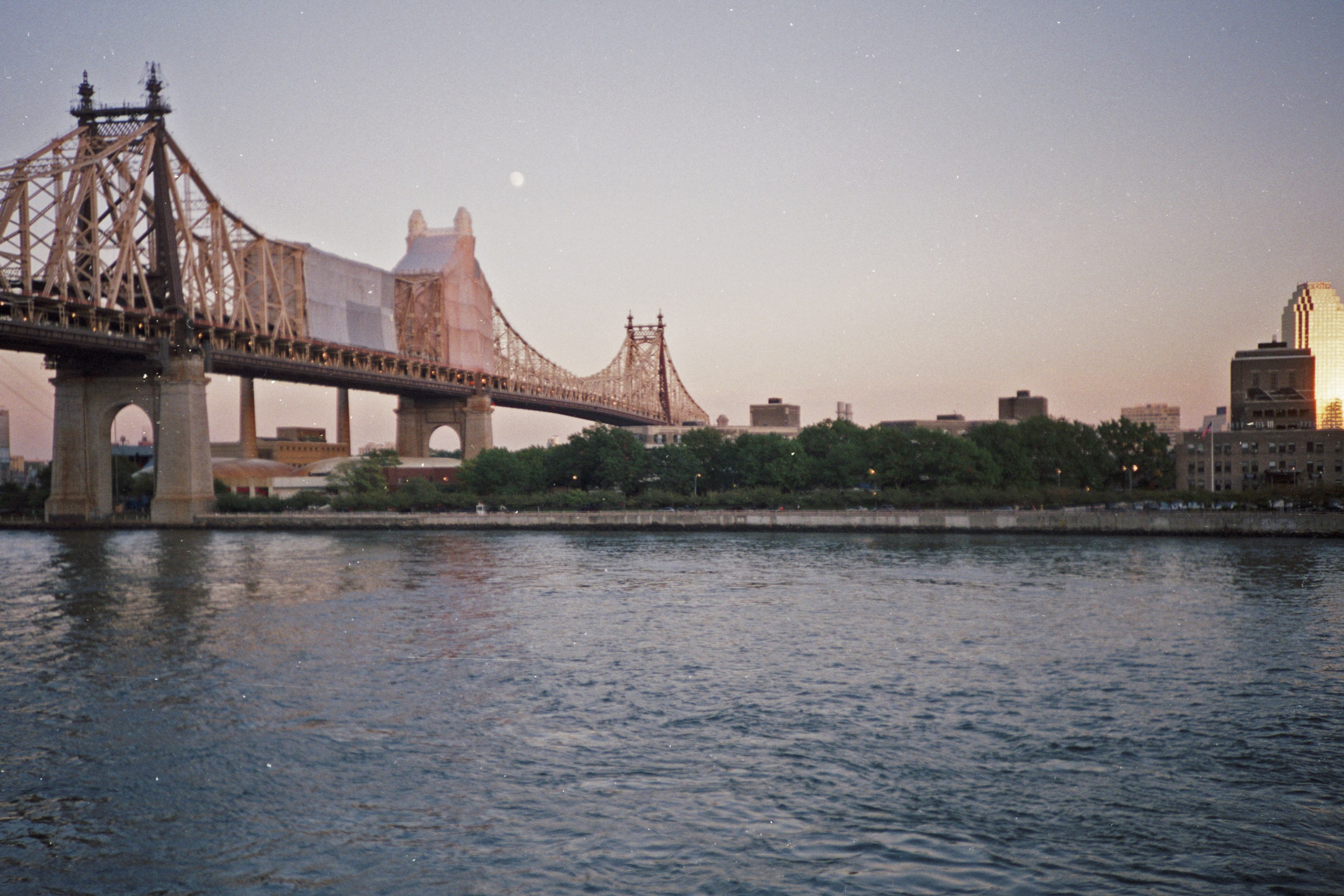 brown concrete bridge over body of water during daytime, 