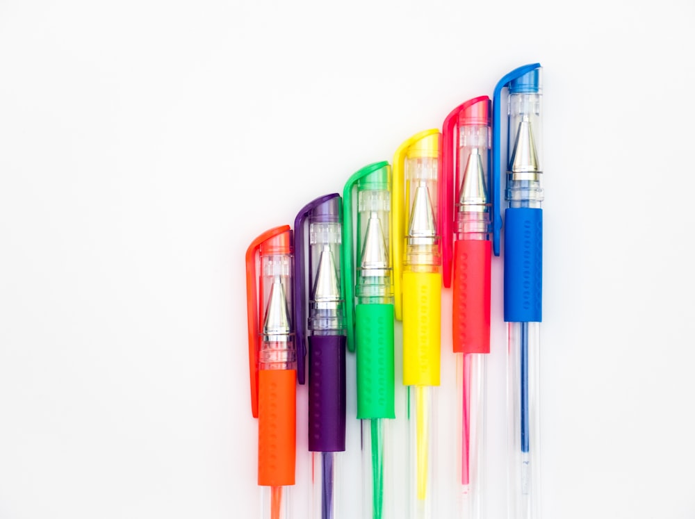 multi colored pen on white background