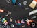 A variety of tools and items are arranged against a black background. These include a drill, a paintbrush, screws, drill bits, pliers, an eraser, some markers, a measuring tape, a spool of twine, and several other small hardware items.