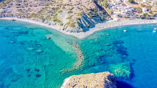 aerial view of green and brown mountain beside blue sea during daytime in Kaloi Limenes Greece