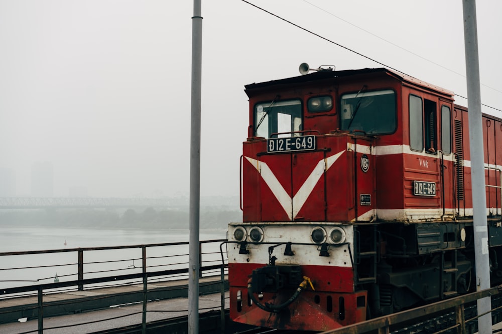 red and black train on rail during daytime