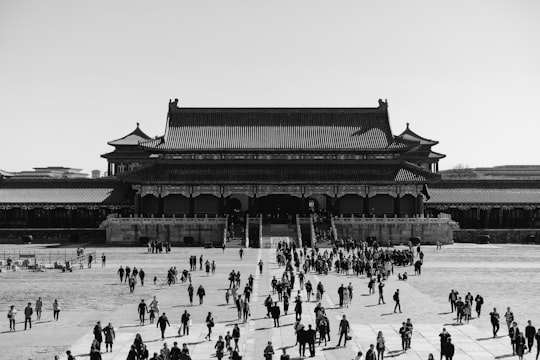 people walking on street near building in The Palace Museum China