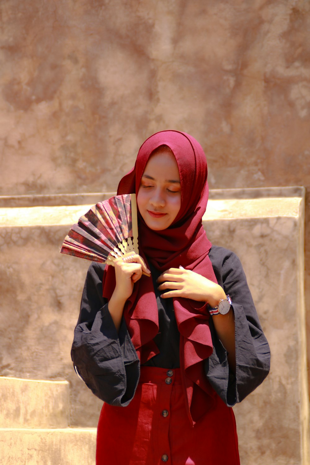 woman in red hijab and black long sleeve shirt