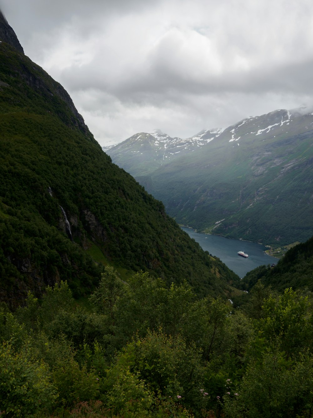 green mountains under white cloudy sky during daytime