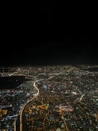 Aerial view of a city with integrated smart lighting and sensors.