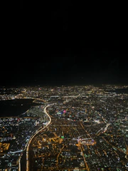 A sleek aerial night view of Jakarta with glowing smart city data overlays.