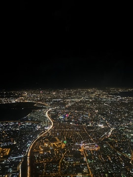 Aerial view of a city with integrated smart lighting and sensors.