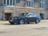 A sleek black VTC car parked near Lyon's train station.