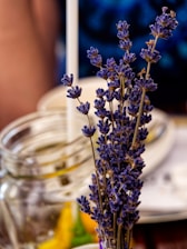 gold and black flower in clear glass jar