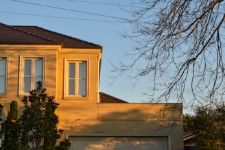 A serene home protected by insurance, bathed in warm sunlight.