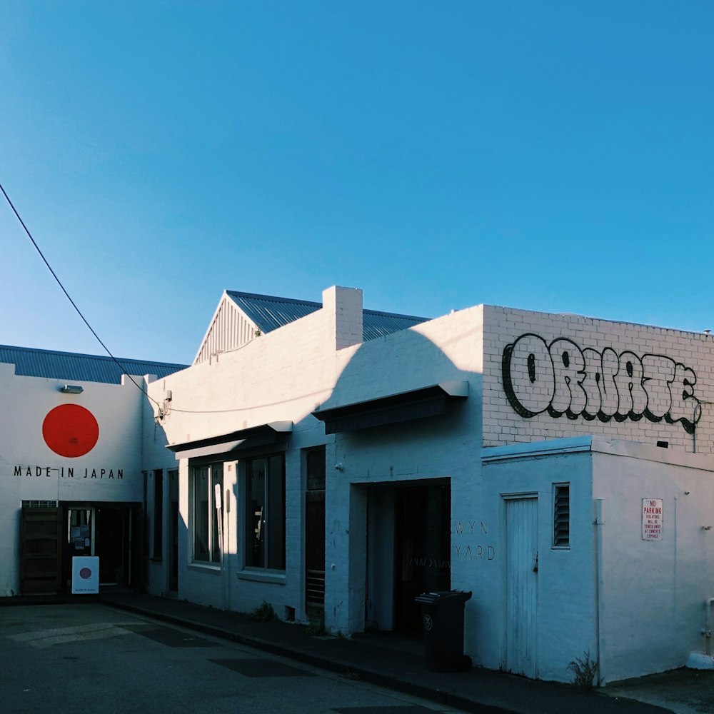 white and blue concrete building under blue sky during daytime