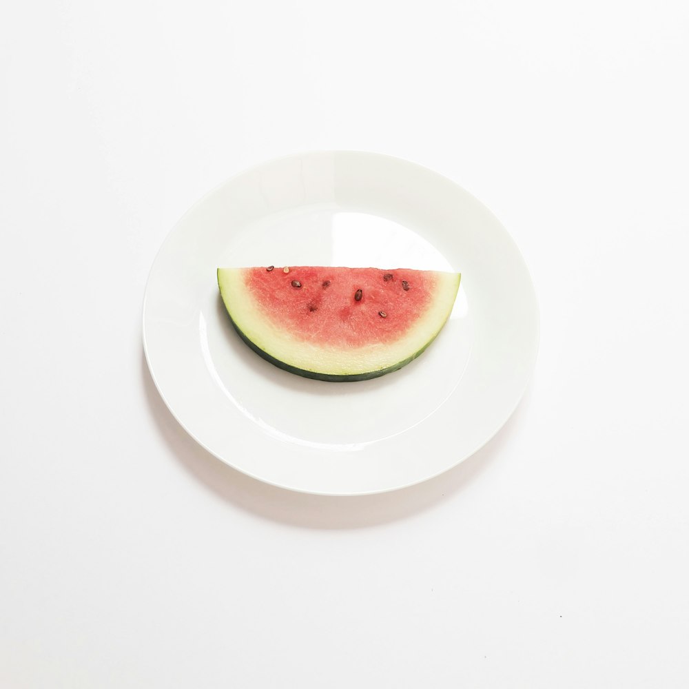 green apple on white ceramic plate