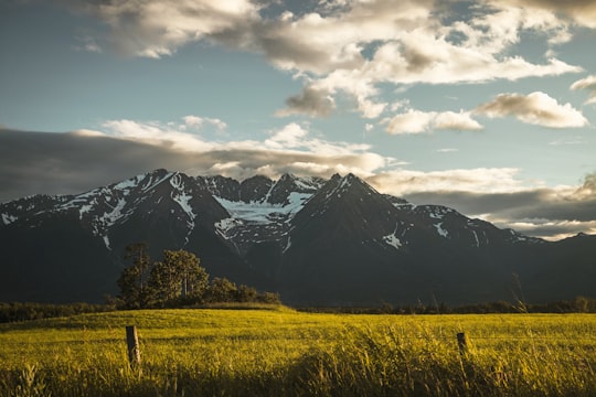 snow covered mountains under cloudy sky during daytime in Smithers Canada