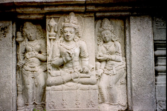 gray concrete statue of man in Prambanan Temple Indonesia