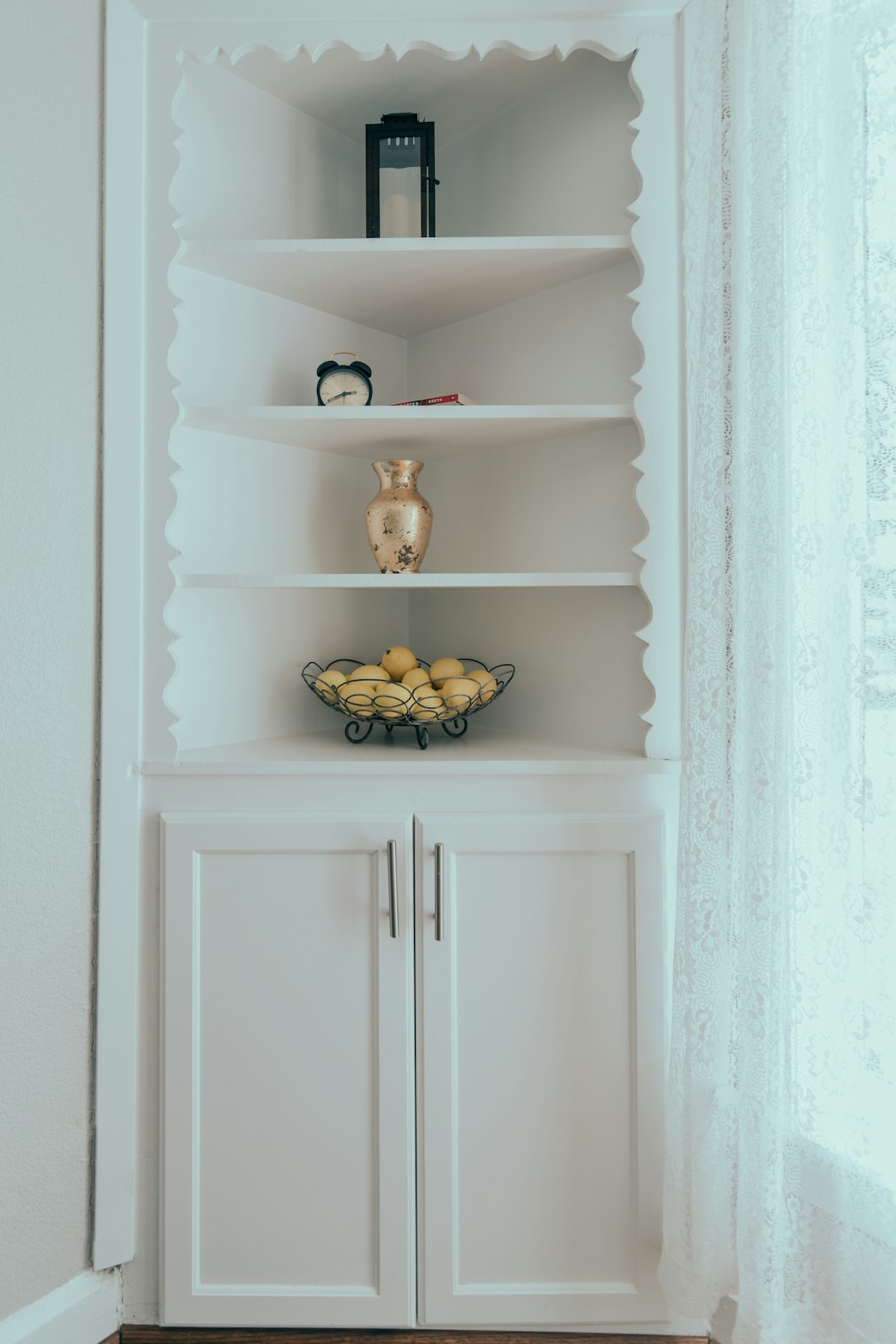  white wooden shelf with fruits cupboard