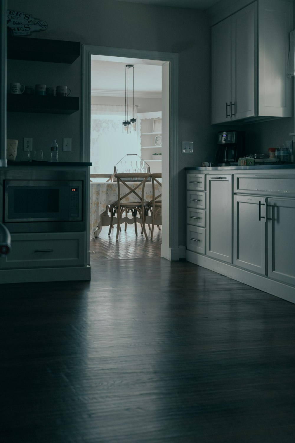 white wooden kitchen cabinet near white wooden door