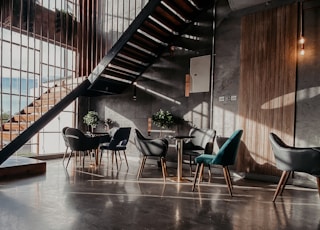 blue and black chairs on brown wooden floor