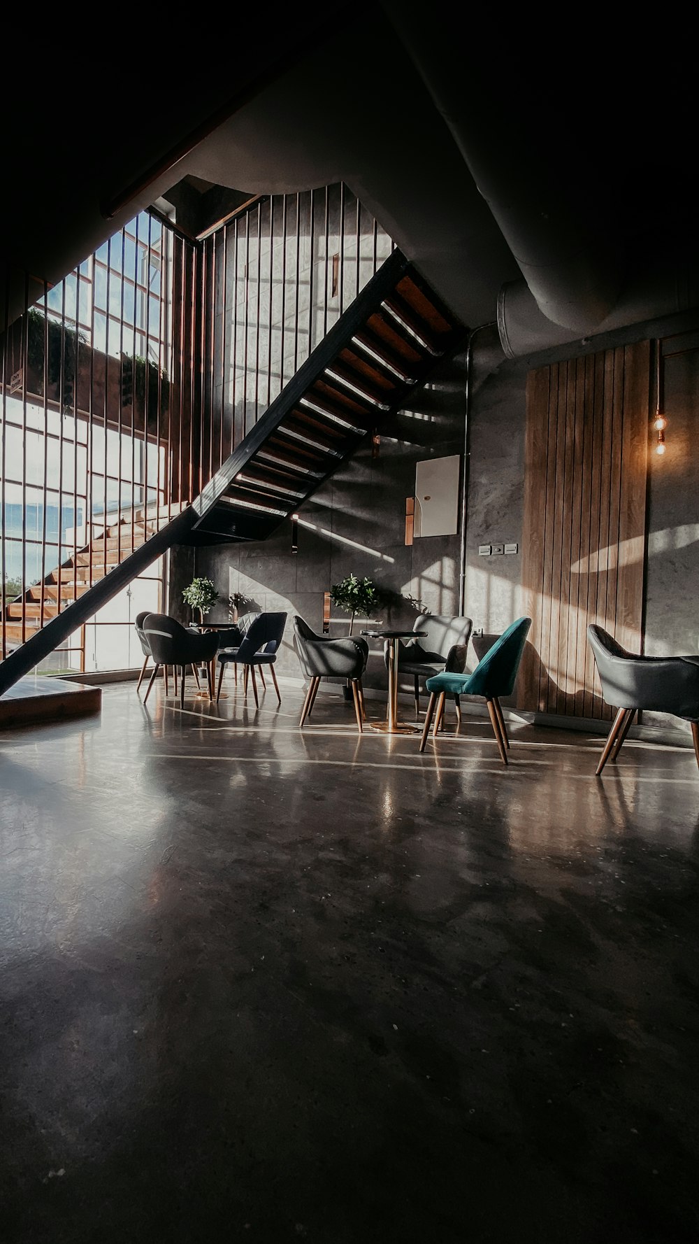 blue and black chairs on brown wooden floor